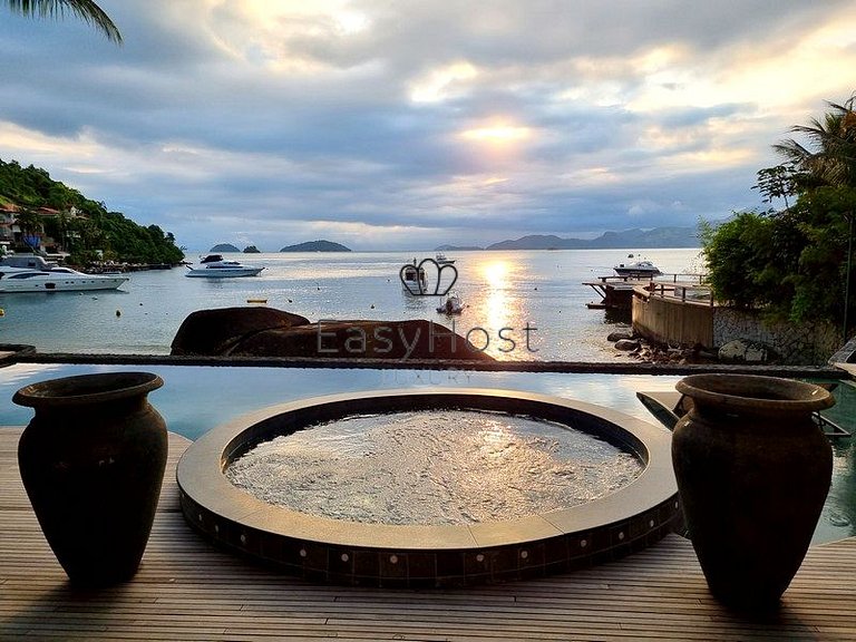 Beachfront house for sale with pool and oceanfront access.