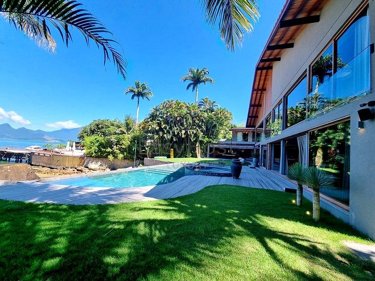 Beachfront house for sale with pool and oceanfront access.