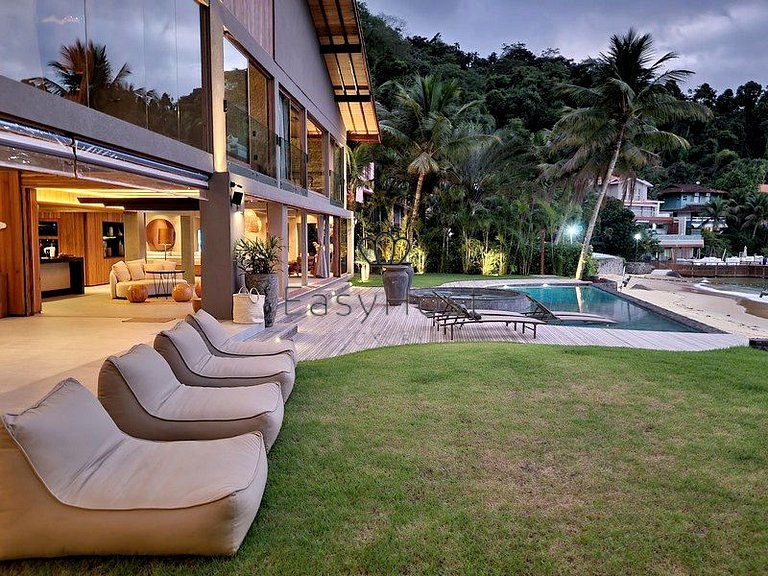 Beachfront house for sale with pool and oceanfront access.