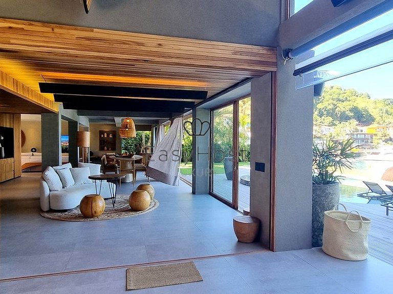 Beachfront house for sale with pool and oceanfront access.