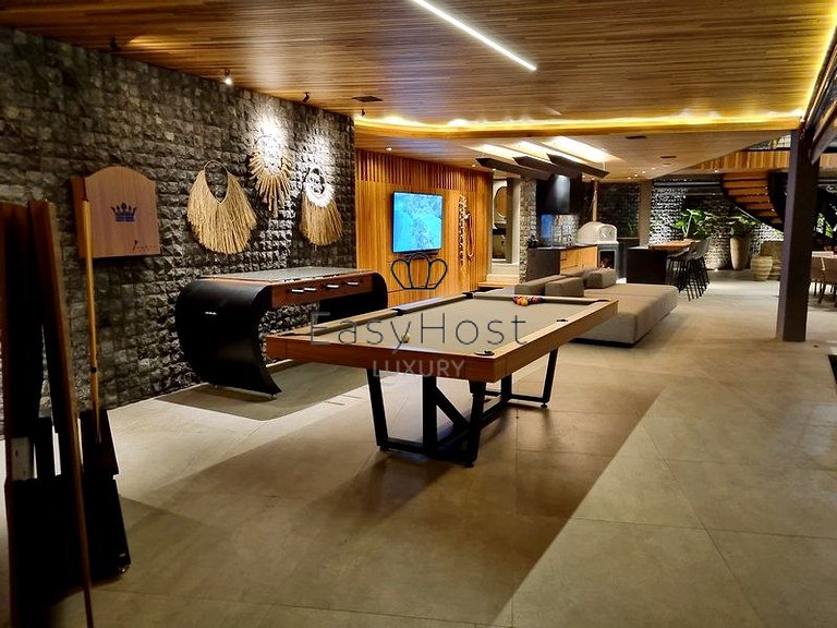 Beachfront house for sale with pool and oceanfront access.