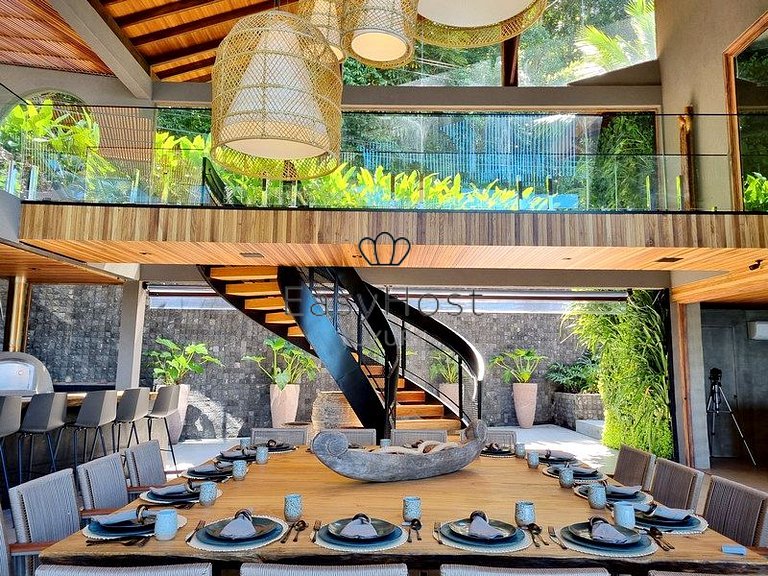 Beachfront house for sale with pool and oceanfront access.