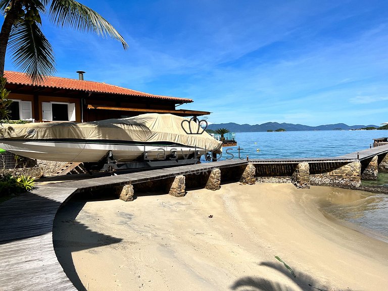 Beachfront house for sale in a gated an idyllic beach.