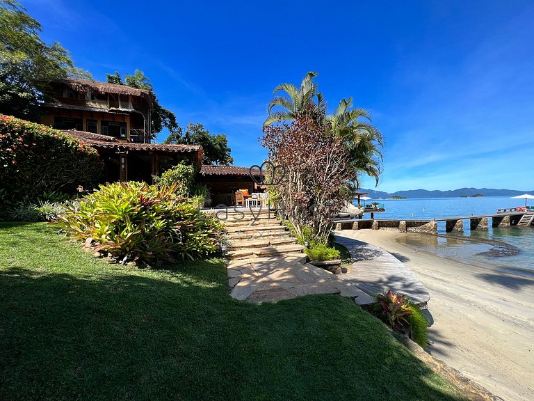 Beachfront house for sale in a gated an idyllic beach.